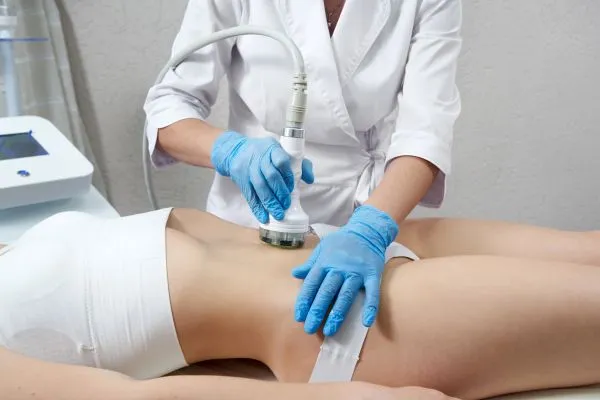 Lost the Weight but Not the Loose Skin? 2 woman having HIFU treatment on her stomach to combat loose skin Drayton following weight loss